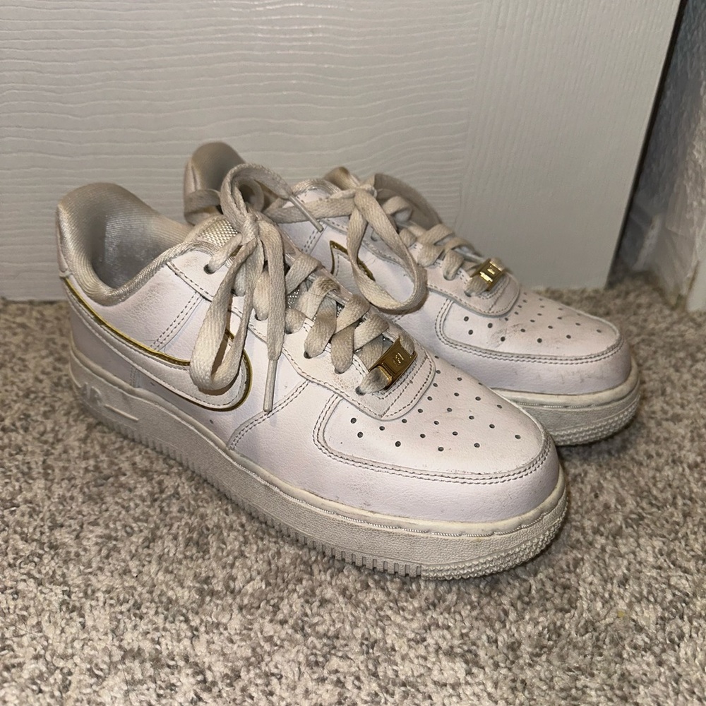 White and Gold Air Force 1 sneakers